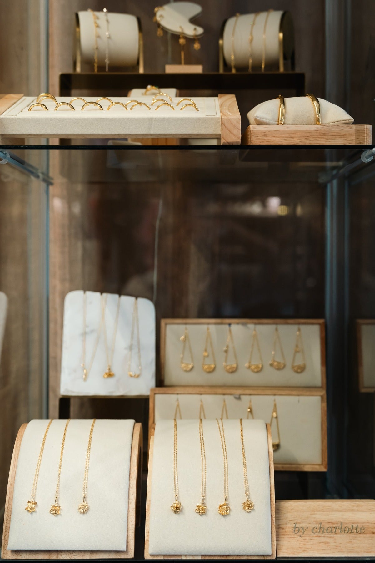Gold jewellery laid out in the glass cabinet at Amelie & Frank's in Red Hill