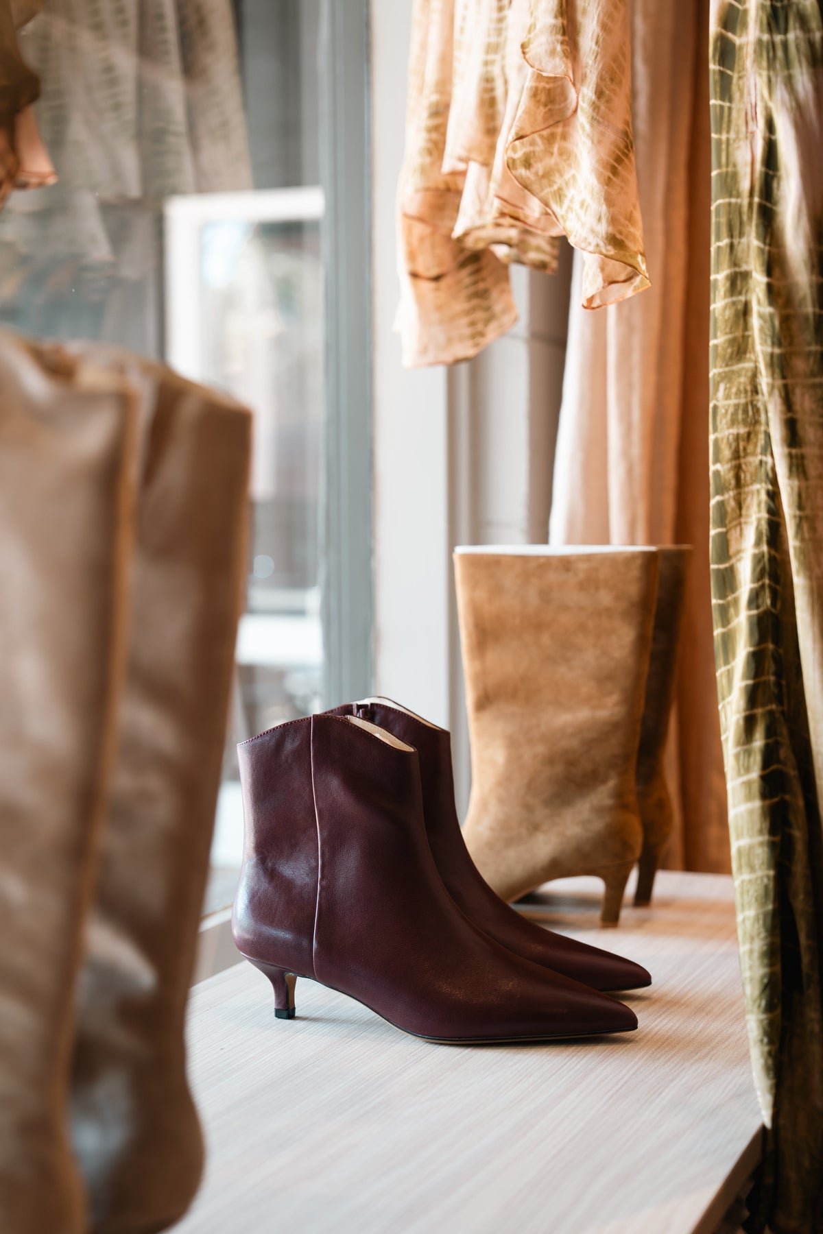 Boots in the window at Amelie & Frank's in Red Hill, seen from the street