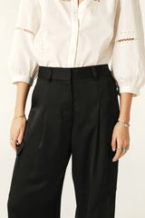 BA&SH Cary Trousers in noir, worn by model, close view of pleated waist