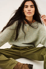 ba&sh Isaac Cardigan in amande, worn by model, seated view