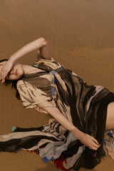 Mes Demoiselles Micasso dress, seated on sand