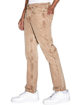 Ksubi Hazlow Jeans in brown dune, worn by model, side view