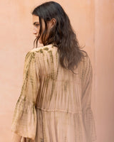 Mes Demoiselles Calm Dress in beige with olive tie-dye, worn by model, close back view of sleeve
