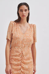 Second Female Mora Mini Dress in tigerlily print, worn by model, close view of V neck and ruching