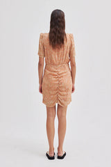 Second Female Mora Mini Dress in tigerlily print, worn by model, back view