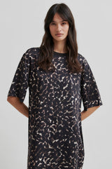 Second Female Savani Printed Dress in dark animal print, worn by model, close front view