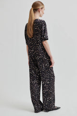 Second Female Savani Trousers in dark animal print, worn by model, back view