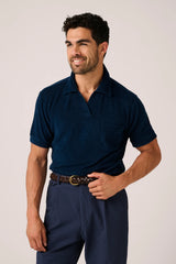 Christian Kimber Coogee Terry Polo in marine, worn by model with navy pleated trousers, front view