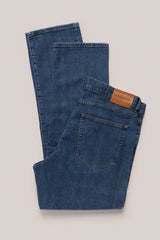 Christian Kimber Rose Street Selvedge Jeans in mid indigo, folded flat showing the back and leather patch