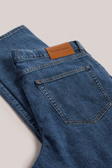 Christian Kimber Rose Street Selvedge Jeans in mid indigo, close detail of the back pocket and leather patch