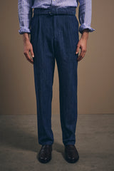 Full-length front view of the denim chinos worn with a striped linen shirt, sleeves rolled
