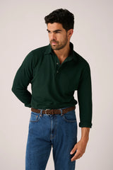 Christian Kimber Hastings Long Sleeve Polo in scarab green, worn by model with blue jeans, front view