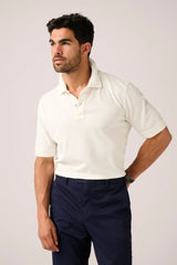 Christian Kimber Rosebud Short Sleeve Polo in off-white, worn by model with navy trousers, front view