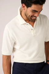 Christian Kimber Rosebud Short Sleeve Polo in off-white, close view of the collar and placket on figure