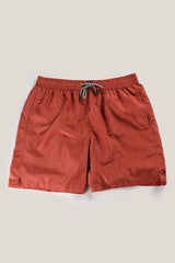 Christian Kimber Rose Bay Swim Shorts in orange, laid flat, studio shot