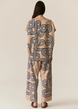 POL Alter Top in tan with navy swirl print, on figure with matching pant, back view