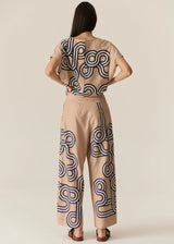 POL Alter Pant in tan with navy swirl print, worn by model with matching top, back view