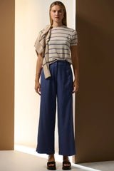 POL Sable Stripe Knit Tee in pebble and blue, worn by model with blue wide-leg trousers, front view