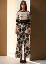 POL Amara Pant in cream with charcoal floral print, on figure, front view with hands relaxed
