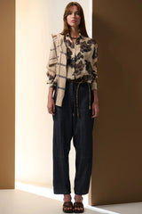 POL Amara Silk Shirt in cream with charcoal floral print, worn by model with a check scarf, front view