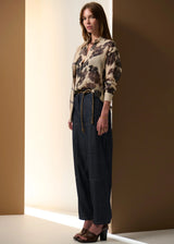 POL Amara Silk Shirt in cream with charcoal floral print, worn tucked into dark denim, front view
