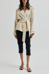 Second Female Estivo Linen Blend Jacket in beige, belted, worn by model, front view