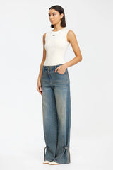 Acler Otham Jean in vintage wash, worn by model, three-quarter view showing tied hems