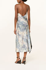 Back view of the blue animal print slip dress, low back and chain straps