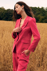Zoe Kratzmann Crest Jacket in rhubarb, worn by model outdoors, angled view
