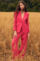Zoe Kratzmann Crest Jacket in rhubarb, worn by model with matching pants in a wheat field