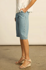 Zoe Kratzmann Compass Short in light washed denim, worn by model, side view