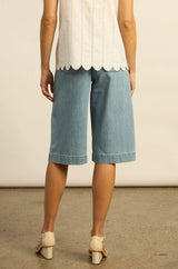 Zoe Kratzmann Compass Short in light washed denim, worn by model, back view