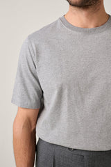 Christian Kimber Apollo T-Shirt in grey, close view of the crew neck and sleeve on figure