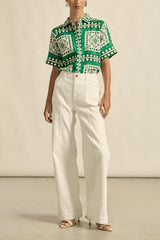 Zoe Kratzmann Valiant Jean in porcelain, worn by model with a green print shirt, full length