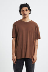 Ksubi 4x4 Biggie Tee in brown, worn by model with black jeans, front view