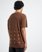 Ksubi 4x4 Biggie Tee in brown, worn by model, three-quarter back view