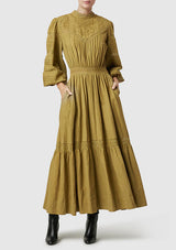 Mos The Label Loom Maxi Dress in olive, on figure with black boots, front view
