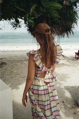 Second Female Bertine Strap Dress in rosebloom check, worn by model on a beach, back view