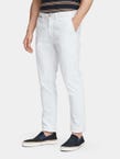 Scotch & Soda Stuart Slim Chino in white, worn by model with navy sneakers, front view
