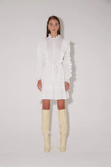 Magali Pascal Luciana Dress in off white, ruffle bib and tie waist, worn by model, front view