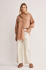 Mos The Label Wanderer Blouse in dusty clay, worn by model with cream jeans, full-length front view