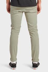 The Academy Brand Cooper Slim Chino in dusty olive, worn by model, cropped back view with rolled hems