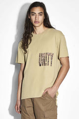Ksubi Crowded Biggie Tee in khaki with Unity print, worn by model, front view