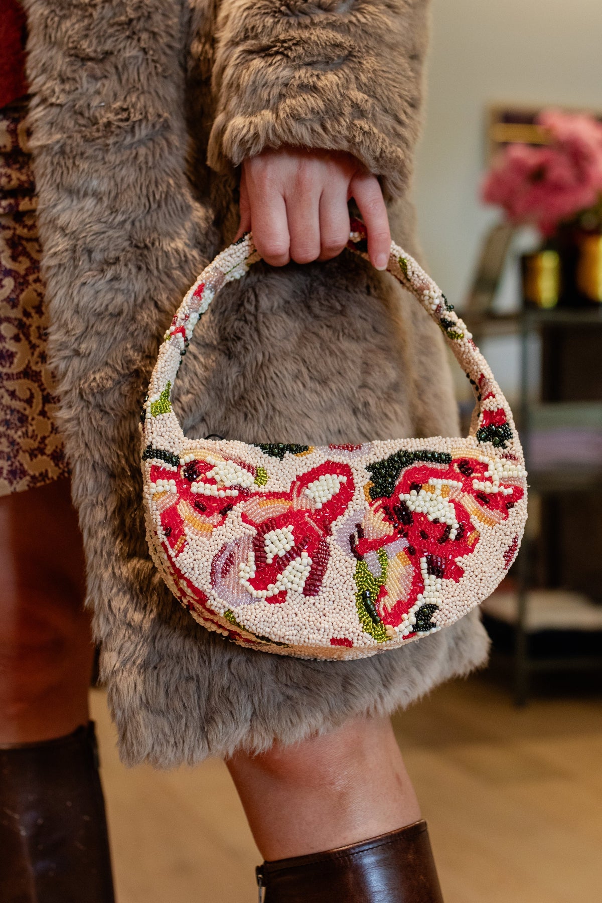 An embroidered shoulder bag carried through the Amelie & Frank's boutique in Red Hill, worn with a shearling coat and tall boots