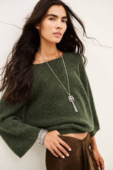 ba&sh Isaac Cardigan in khaki, worn by model, waist-up front view showing wide sleeves