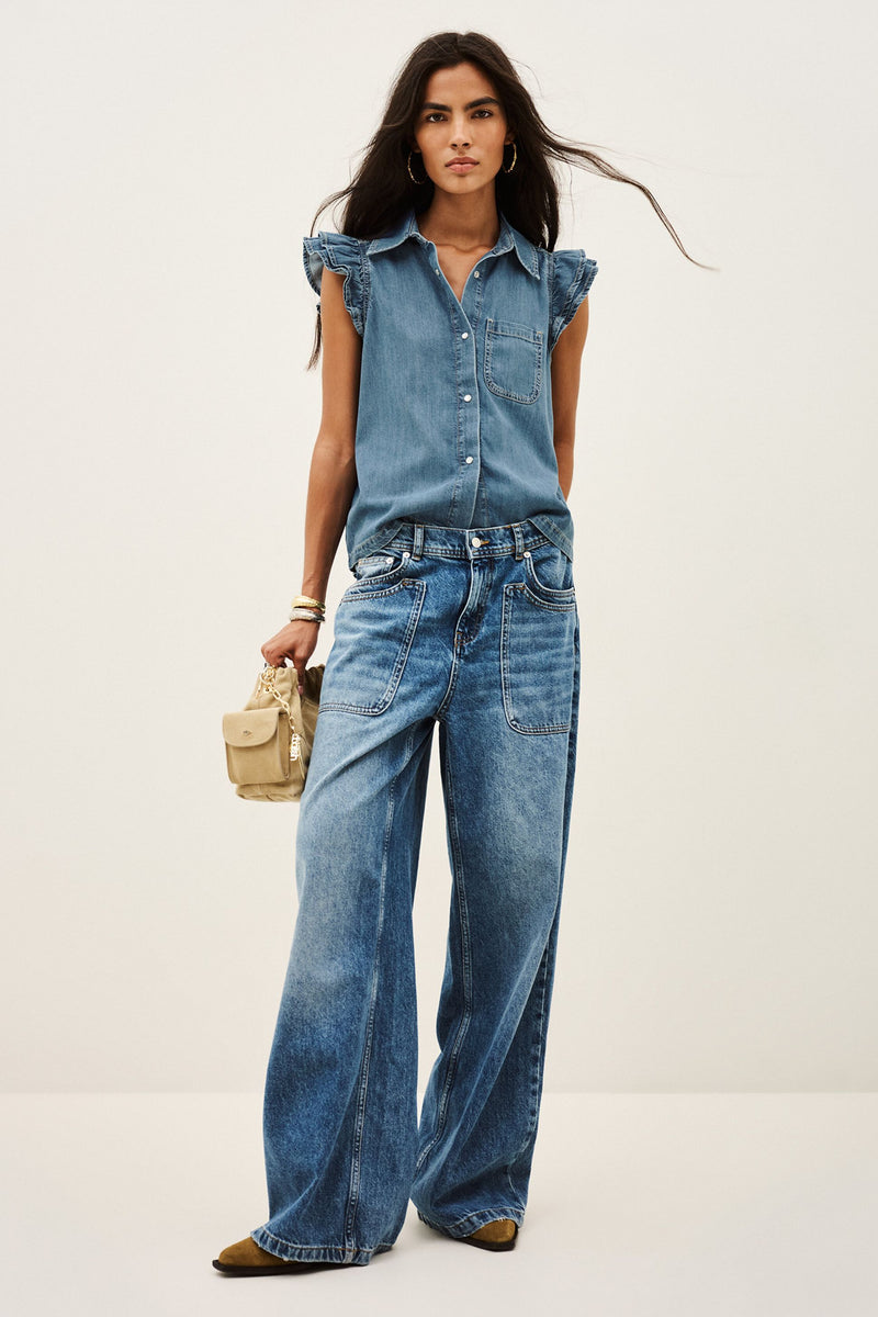 ba&sh Yoyo Shirt in blue jeans, worn by model with wide jeans, full length front view