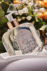 Santa Maria Novella Acqua della Regina Bath Gel, pump bottle on white silk, close still life