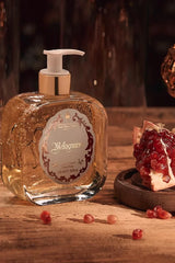Santa Maria Novella Melograno Liquid Soap, pump bottle with pomegranate halves, close still life