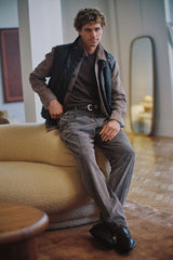 Chocolate quilted lambskin vest, seated three-quarter view