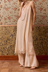 Nude Balma silk slip dress worn over matching wide trousers, front view